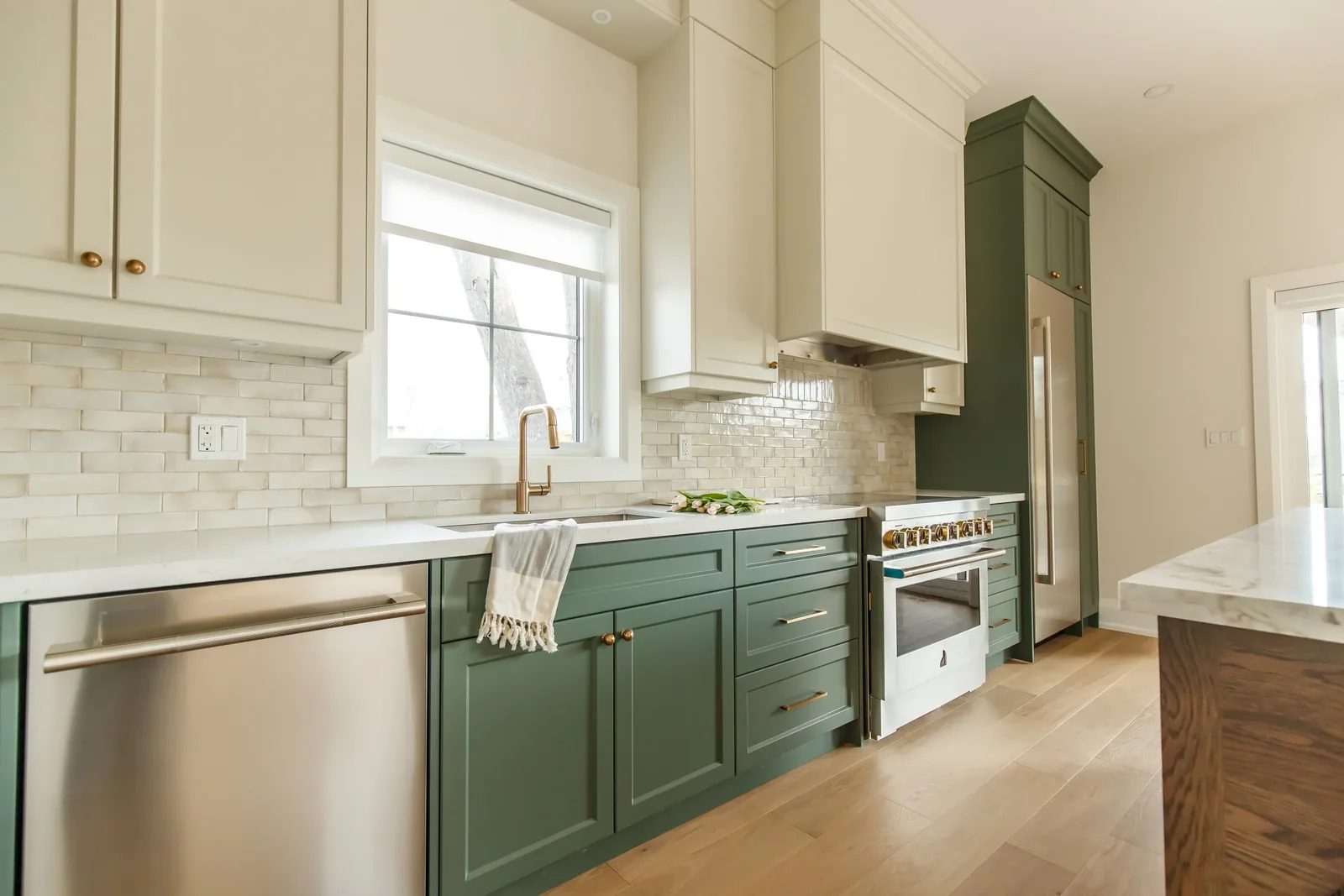 Galley kitchen with cream uppers