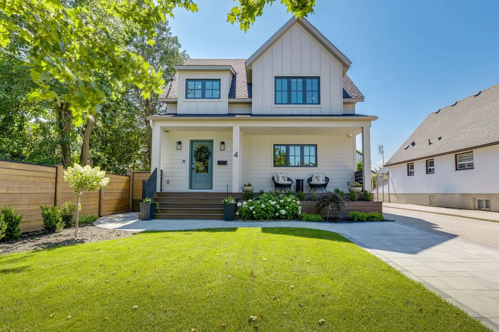 The finished two-storey home from the same street vantage after the second-storey addition, Modern Sanctuary project.