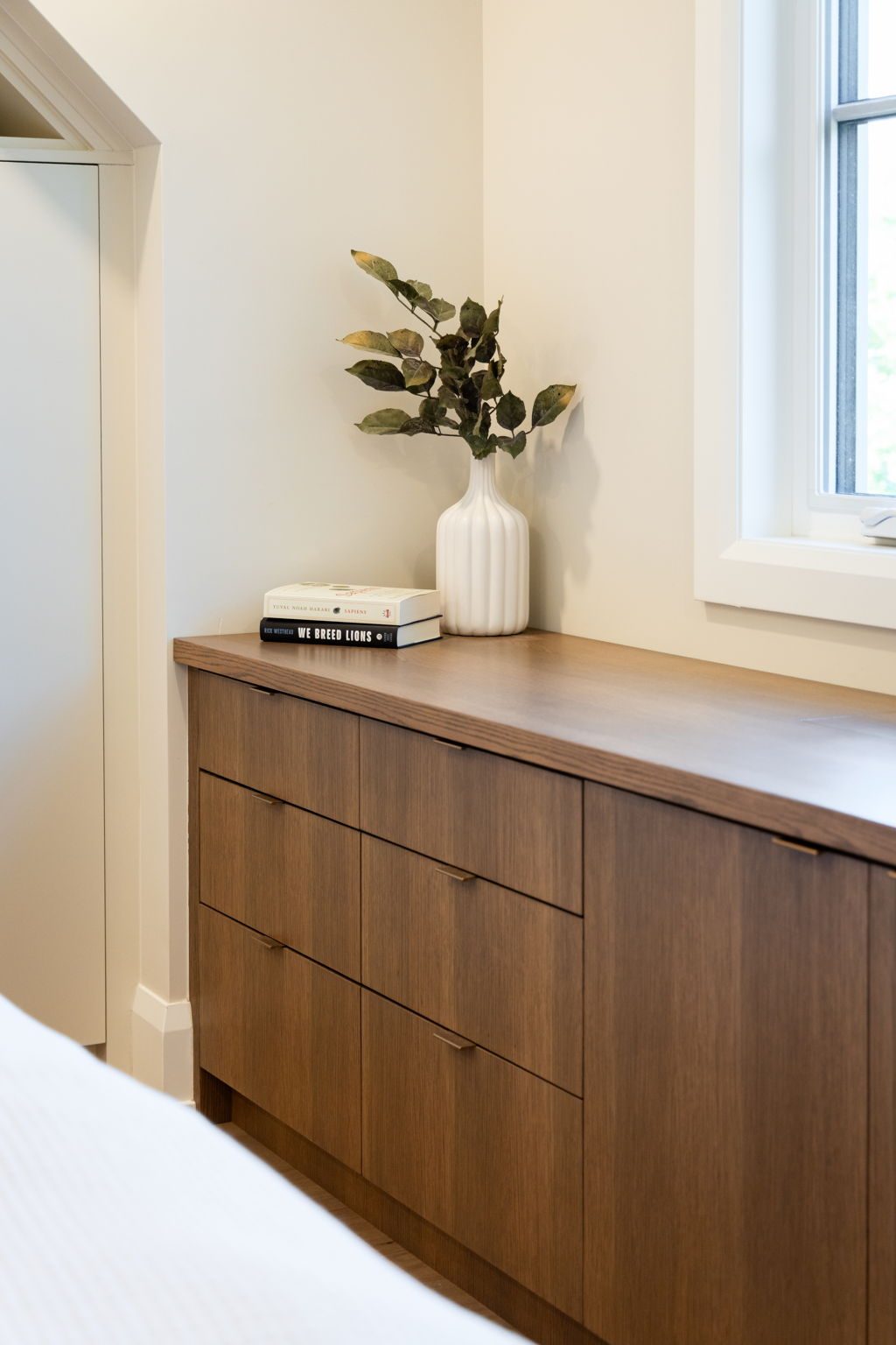 Walnut dresser run in detail, showing the drawer fronts, the edge profile and the counter return under the window.