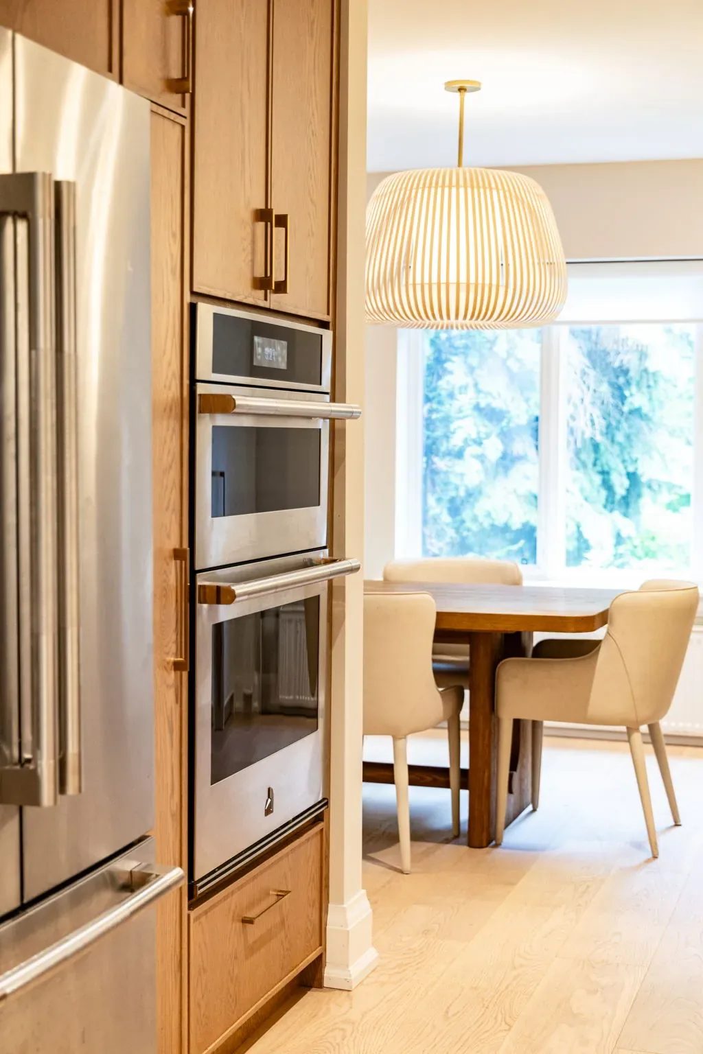 Wide view from the wall ovens through to the dining nook.
